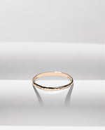 Gold filled ring on a white cloth