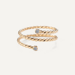 Gold filled twisted ring with moissanite accents on a white background