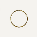 Gold filled ring with a textured design on a light beige background