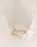 Gold filled ring on a textured white surface