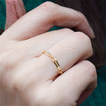 Gold filled chain ring on a persons hand