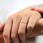 Gold filled chain ring on a persons hand