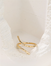 Gold filled ring on a textured white surface