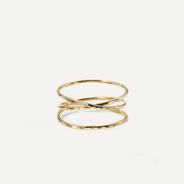 Gold filled ring with a twisted design on a white background