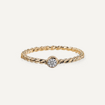 Gold filled ring with a moissanite on a white background