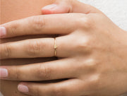 Gold filled heart charm ring on models finger